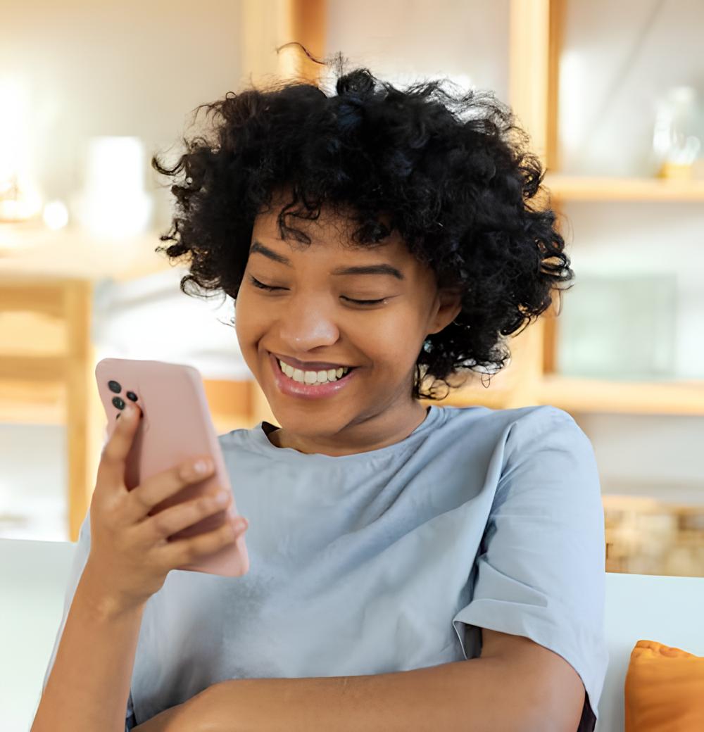 Beautiful lady using PhiloSMS on her phone